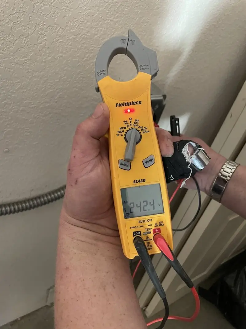 Voltage testing with clamp meter during Ceiling Fan Installation in Chattahoochee